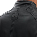 BLACK LEATHER JACKET WITH HIGH COLLAR AND QUILTED DETAILS