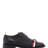 ELEGANT WHOLECUT SHOES IN BLACK CALFSKIN WITH RWB BOW