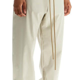 WIDE LEG NYLON TRACK PANTS IN CEMENT