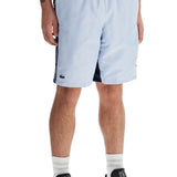 WITH LOGO ON THE BERMUDA SHORTS